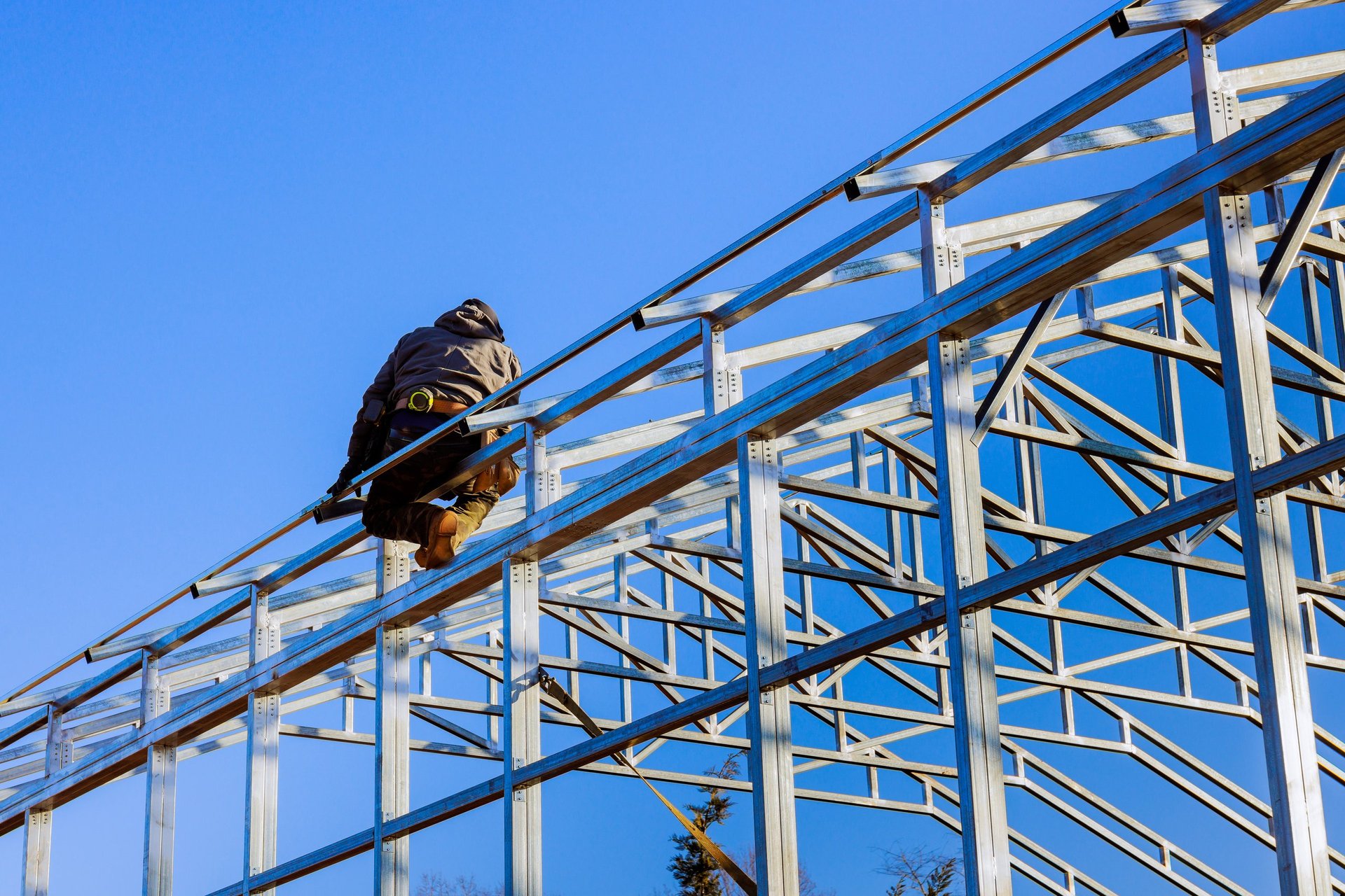 Construction workers assembling steel framework